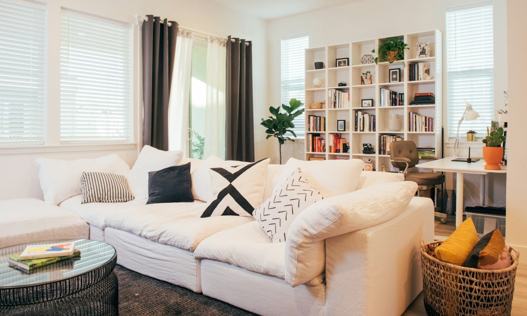A living room filled with furniture and a large window